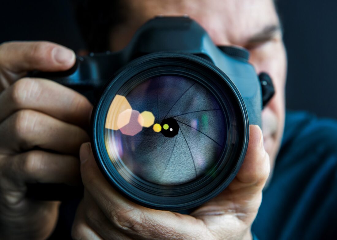 man with a camera taking a photo